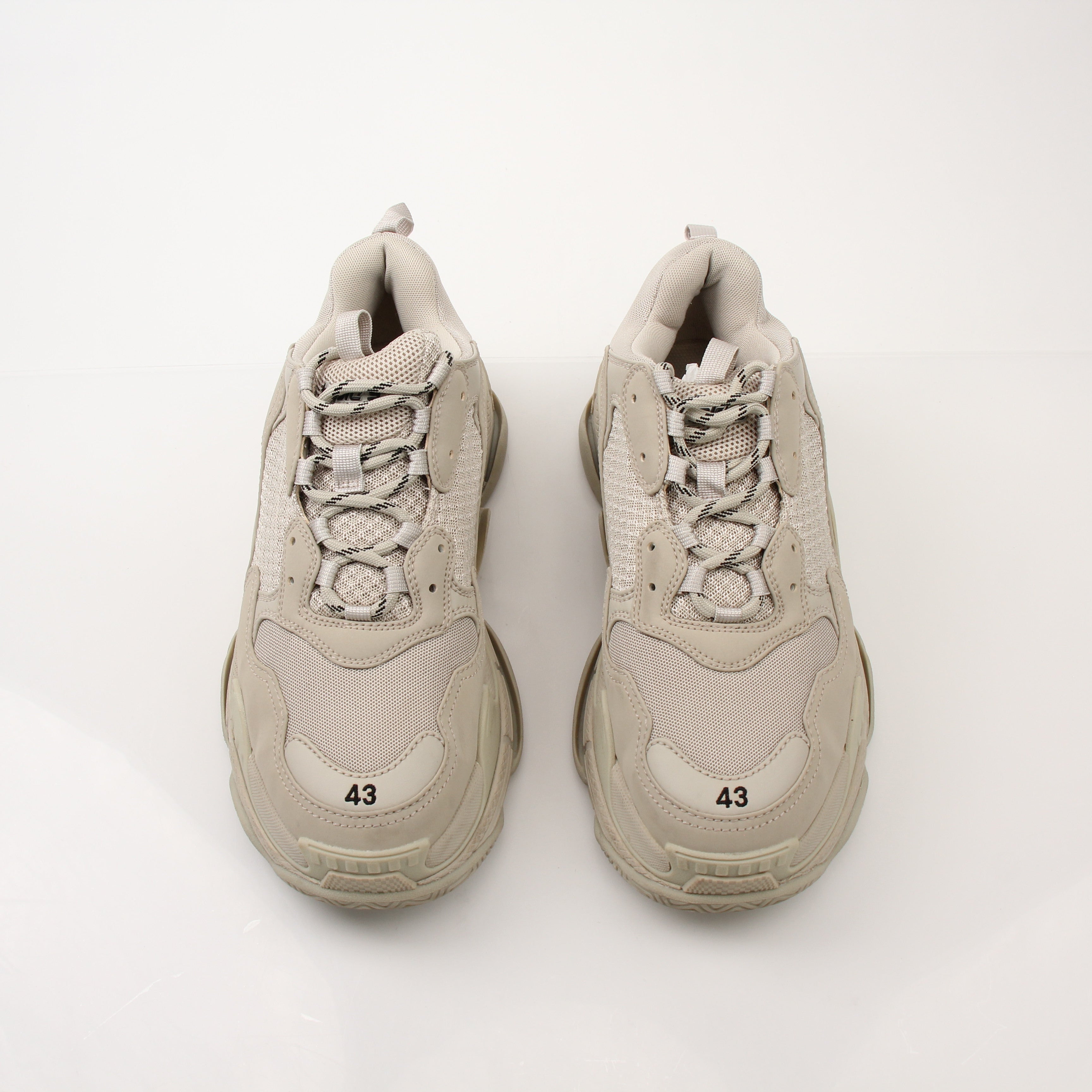 Gold & Beyond men's Balenciaga Triple S sneakers with chunky design, white and beige color, and textured sole.