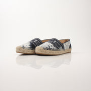Christian Dior women’s Granville tie-dye espadrille flats with woven soles and colorful fabric uppers.
