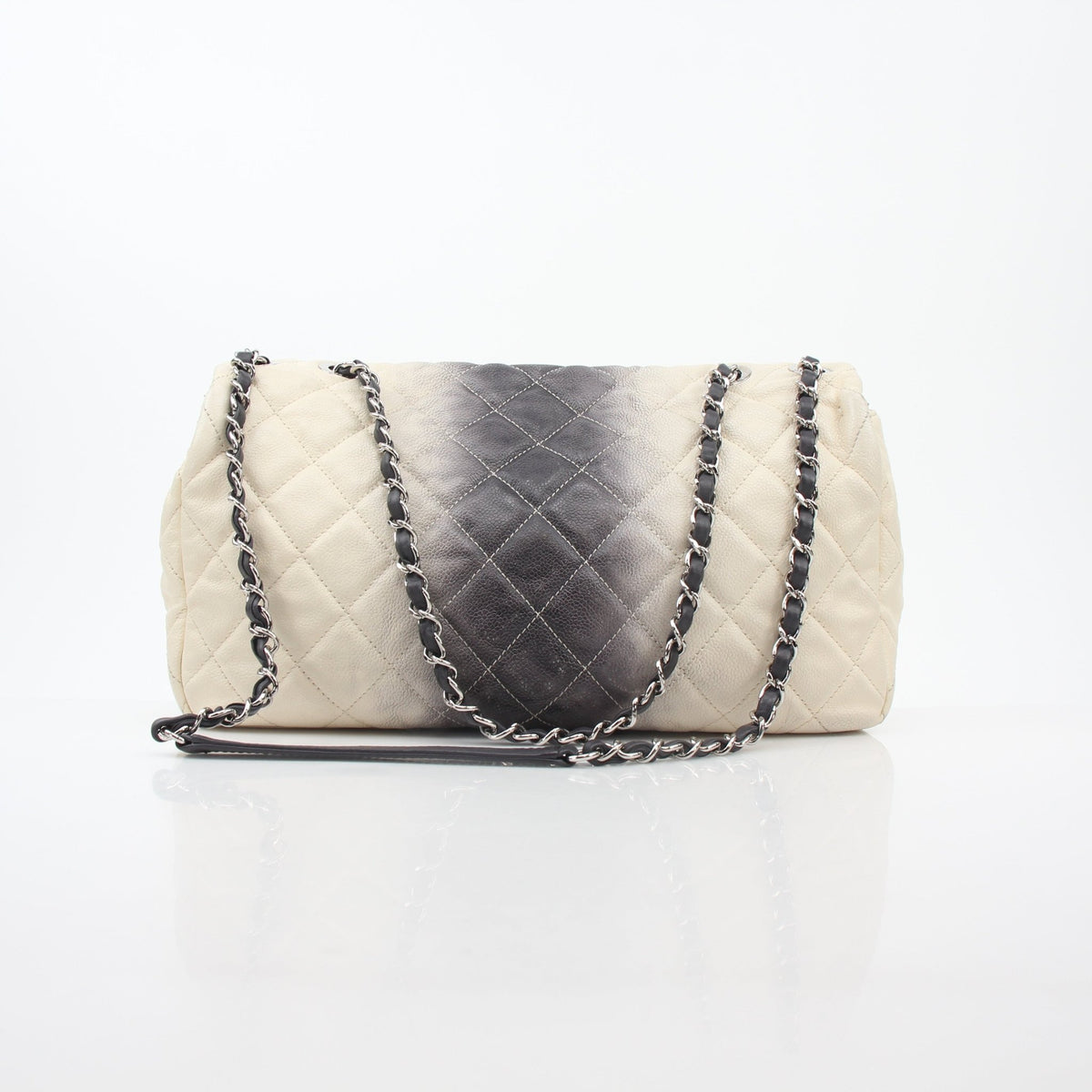 Chanel white and black ombre jumbo single flap handbag with gold chain strap and quilted leather detailing.