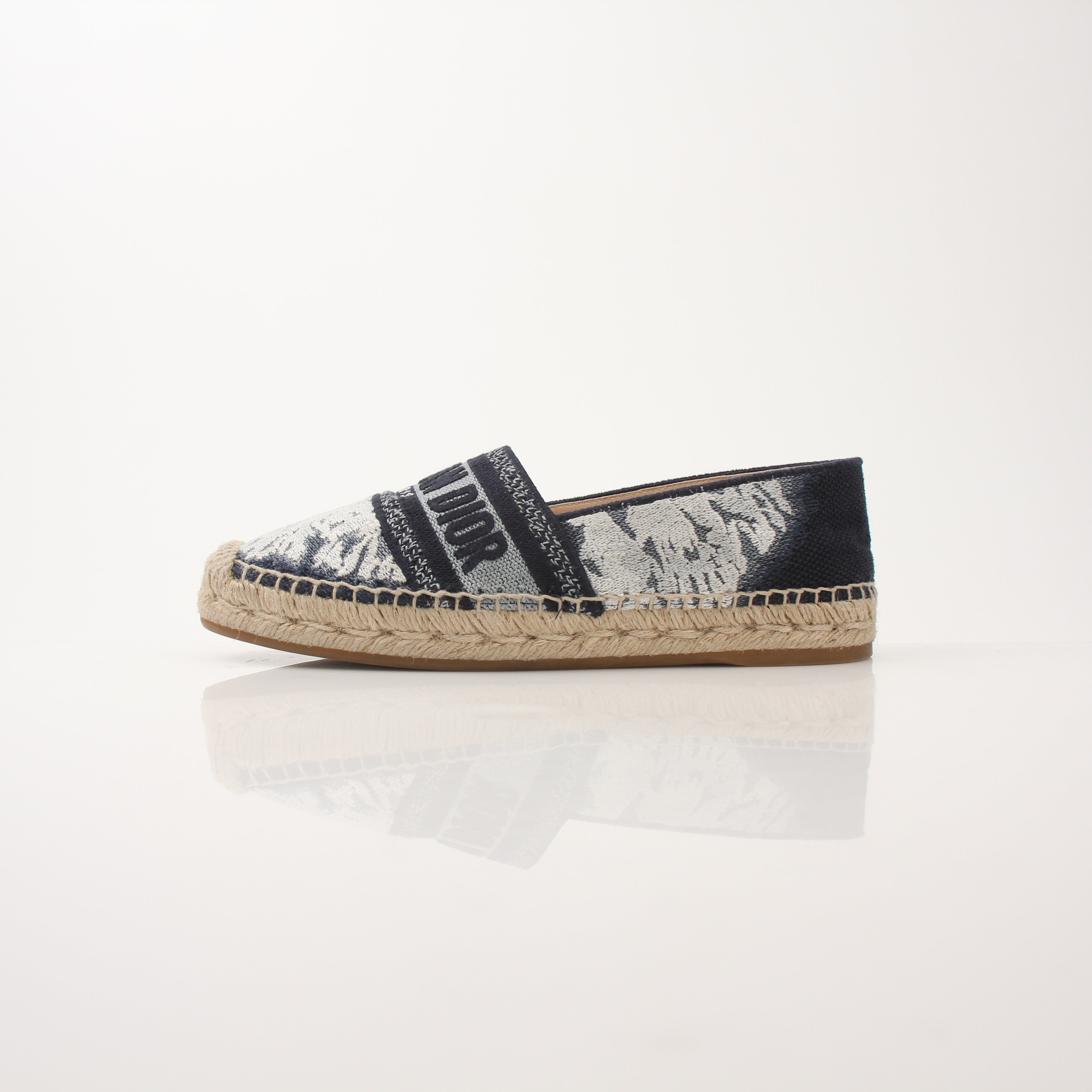 Christian Dior women's Granville tie-dye espadrille flats with woven sole and colorful fabric upper, stylish and comfortable shoes.