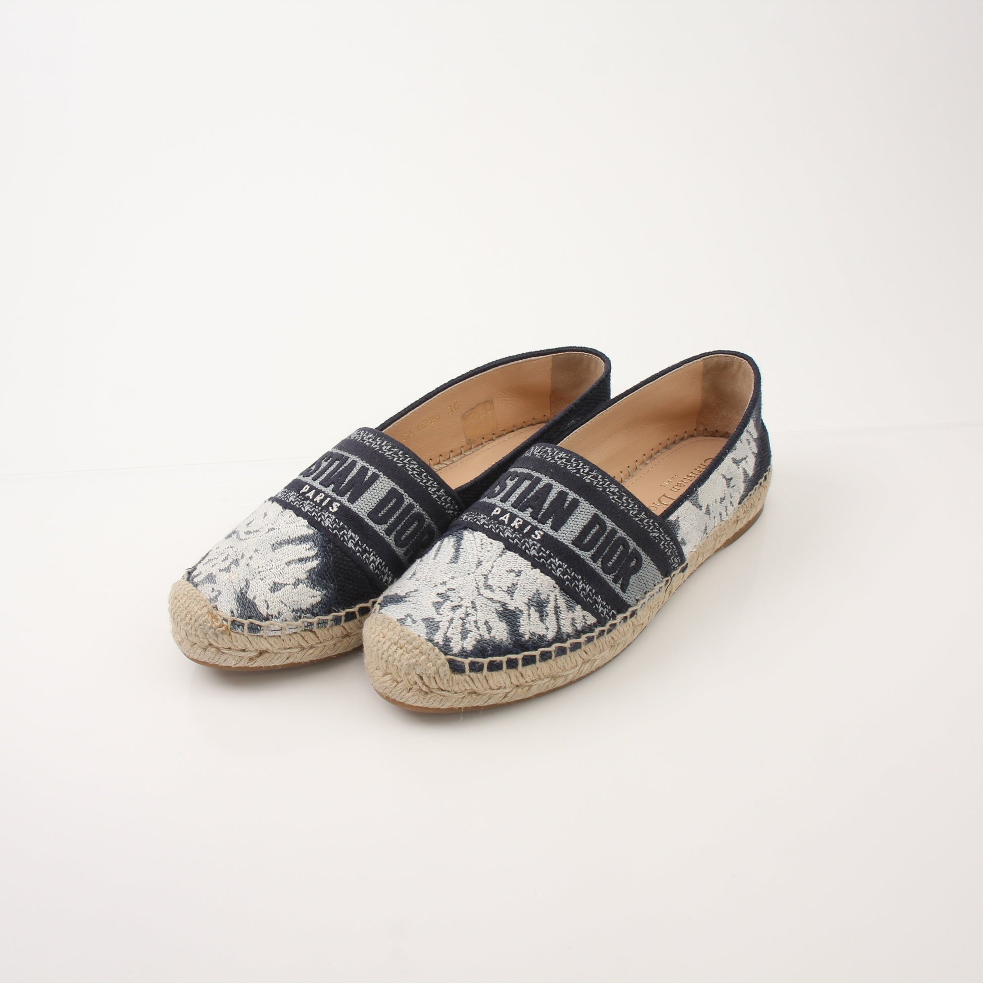 Christian Dior Women’s Granville Tie Dye Espadrille Flats with woven jute soles and colorful tie dye fabric, stylish and comfortable shoes