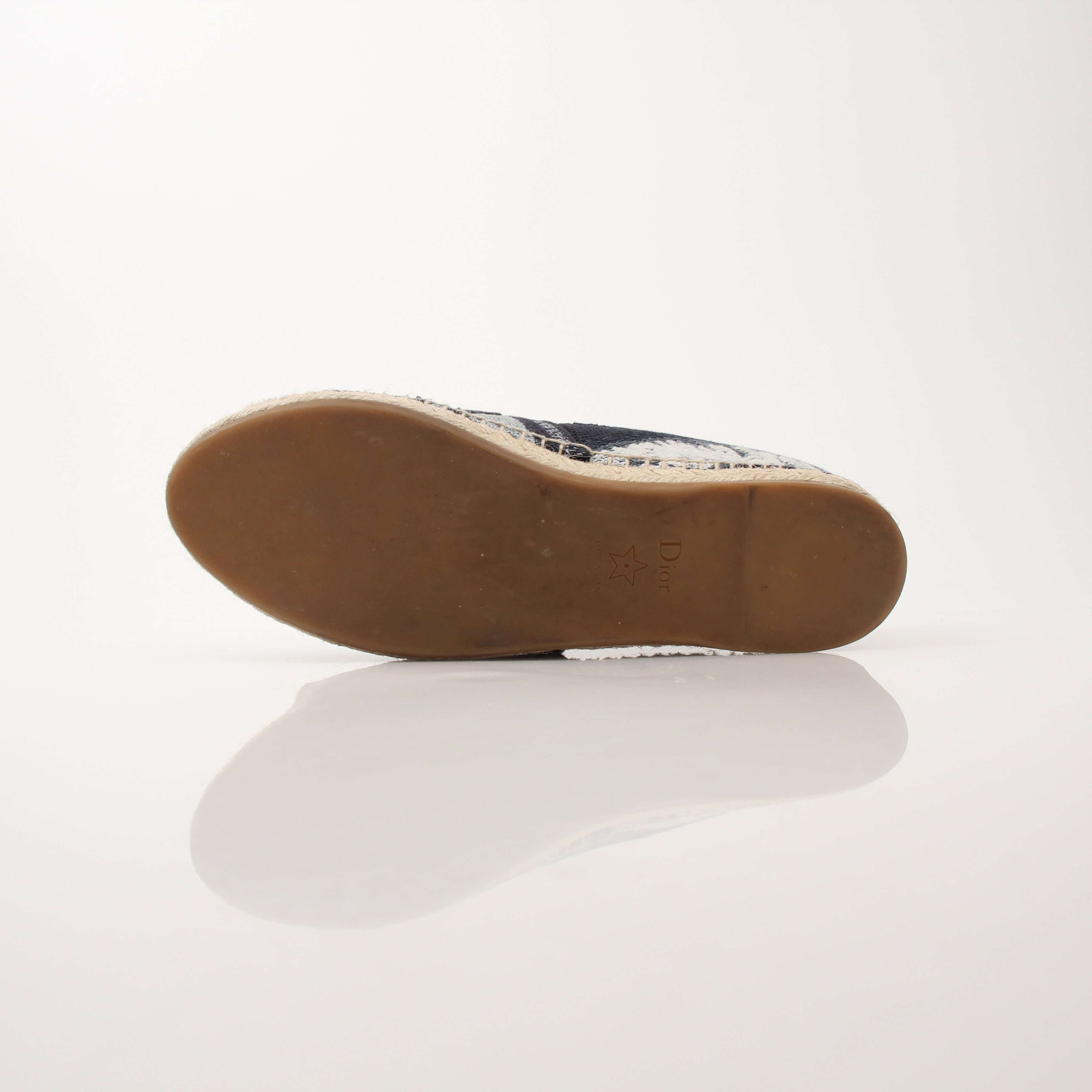 Christian Dior women’s Granville tie-dye espadrille flats featuring colorful fabric and woven jute sole, casual summer shoes.