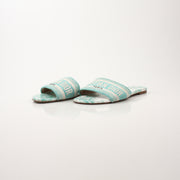 Christian Dior women's aquamarine D-Way slide sandals with streamlined design and slip-on style, featuring metallic finish.
