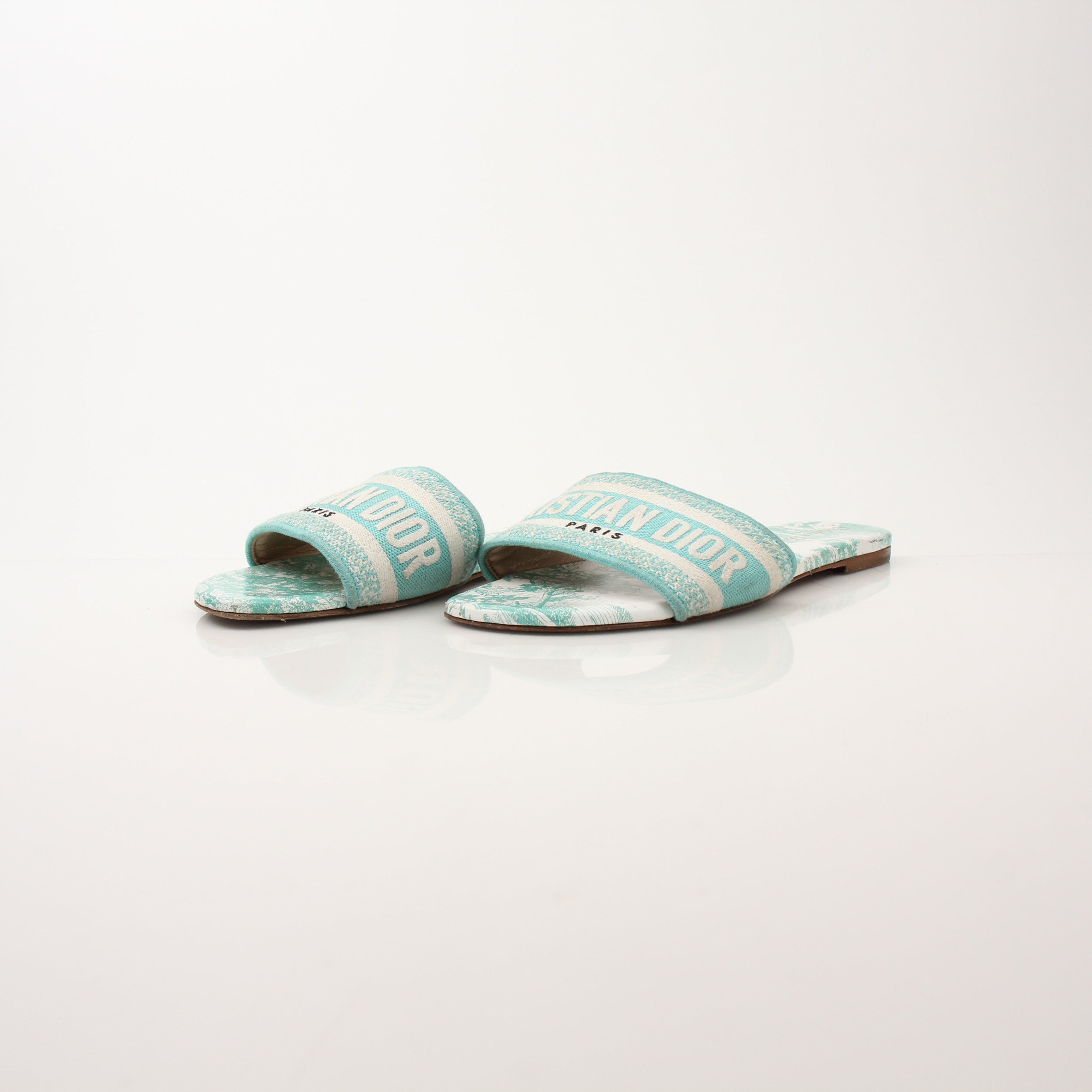 Christian Dior women's aquamarine D-Way slide sandals with streamlined design and slip-on style, featuring metallic finish.