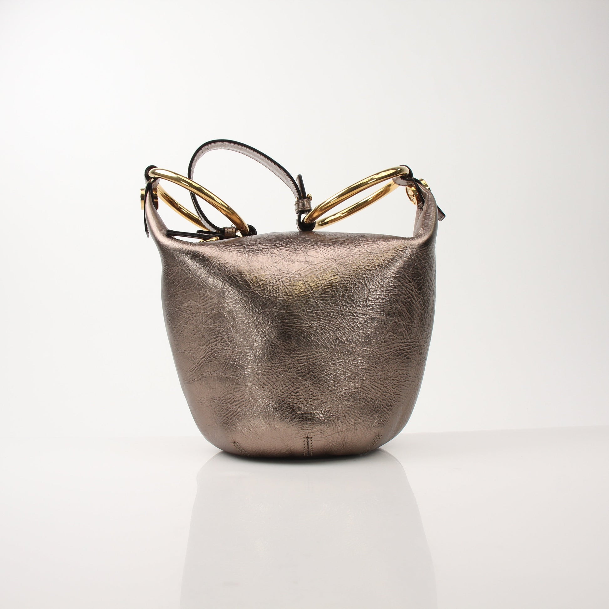 Gold & Beyond Chloé Nile bracelet metallic bucket handbag with chain strap and structured design.