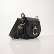 Gold & Beyond Chloé Tess Saddle Bag handbag with adjustable strap and signature saddle design, shown in tan leather.