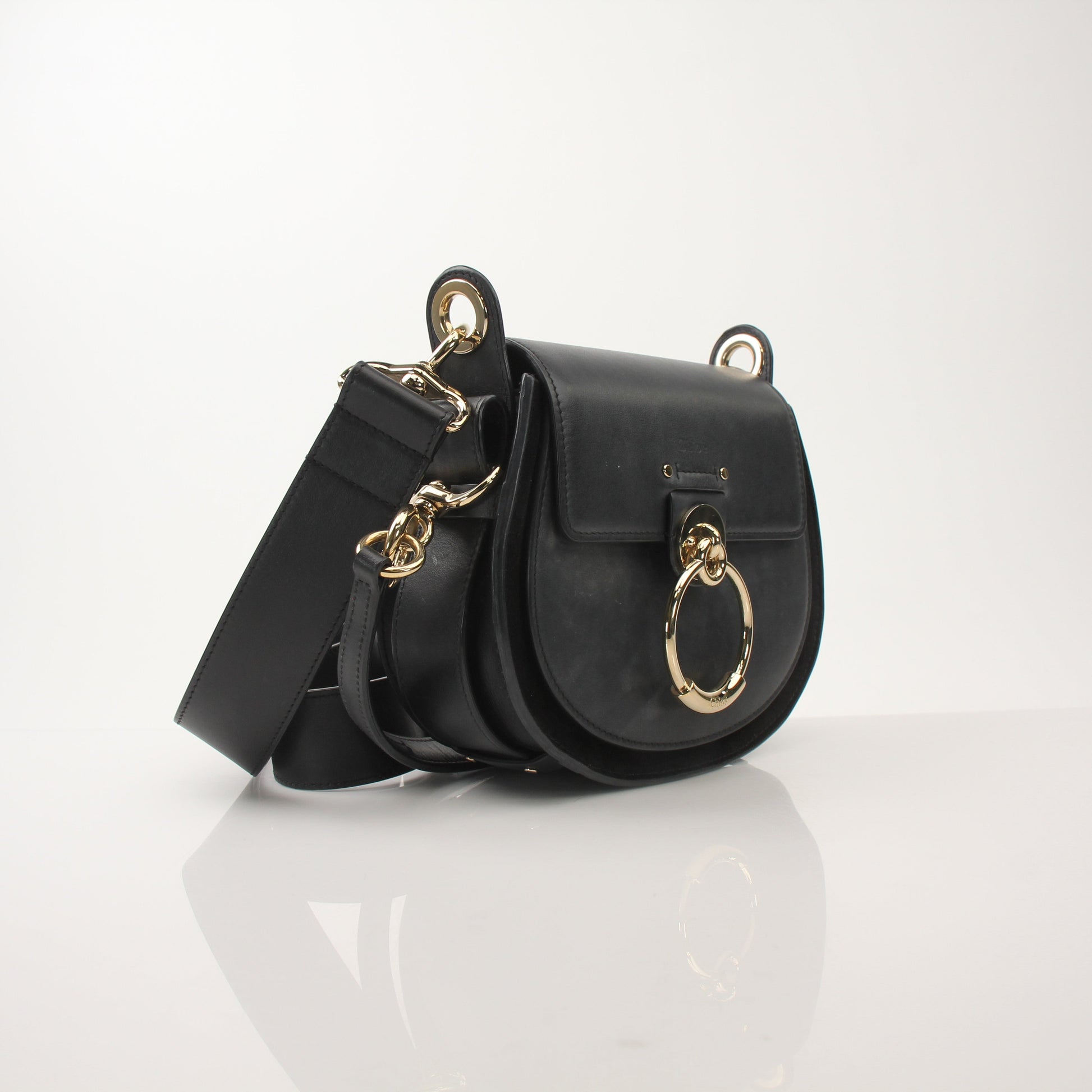 Gold & Beyond Chloé Tess Saddle Bag handbag with adjustable strap and signature saddle design, shown in tan leather.