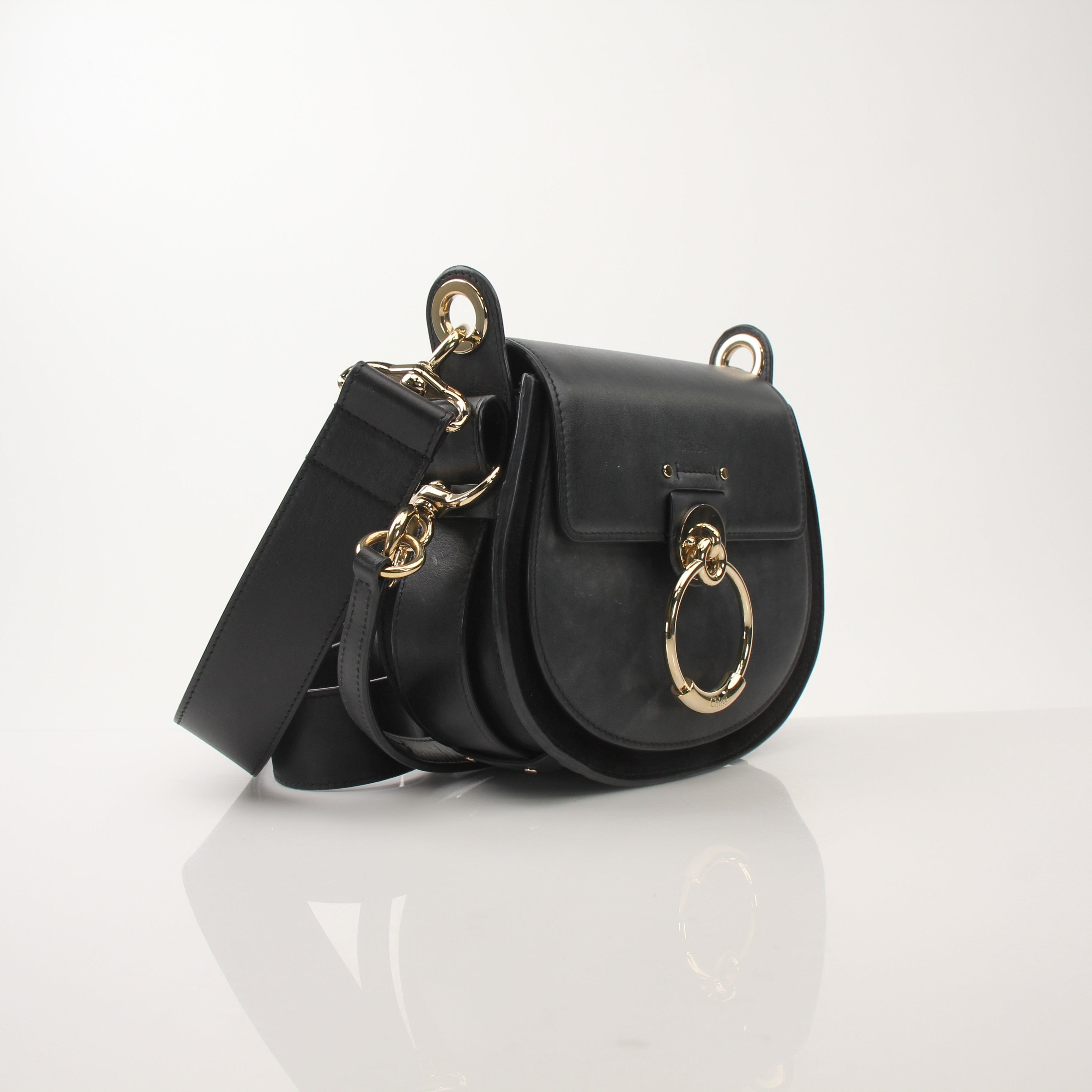 Gold & Beyond Chloé Tess Saddle Bag handbag with adjustable strap and signature saddle design, shown in tan leather.