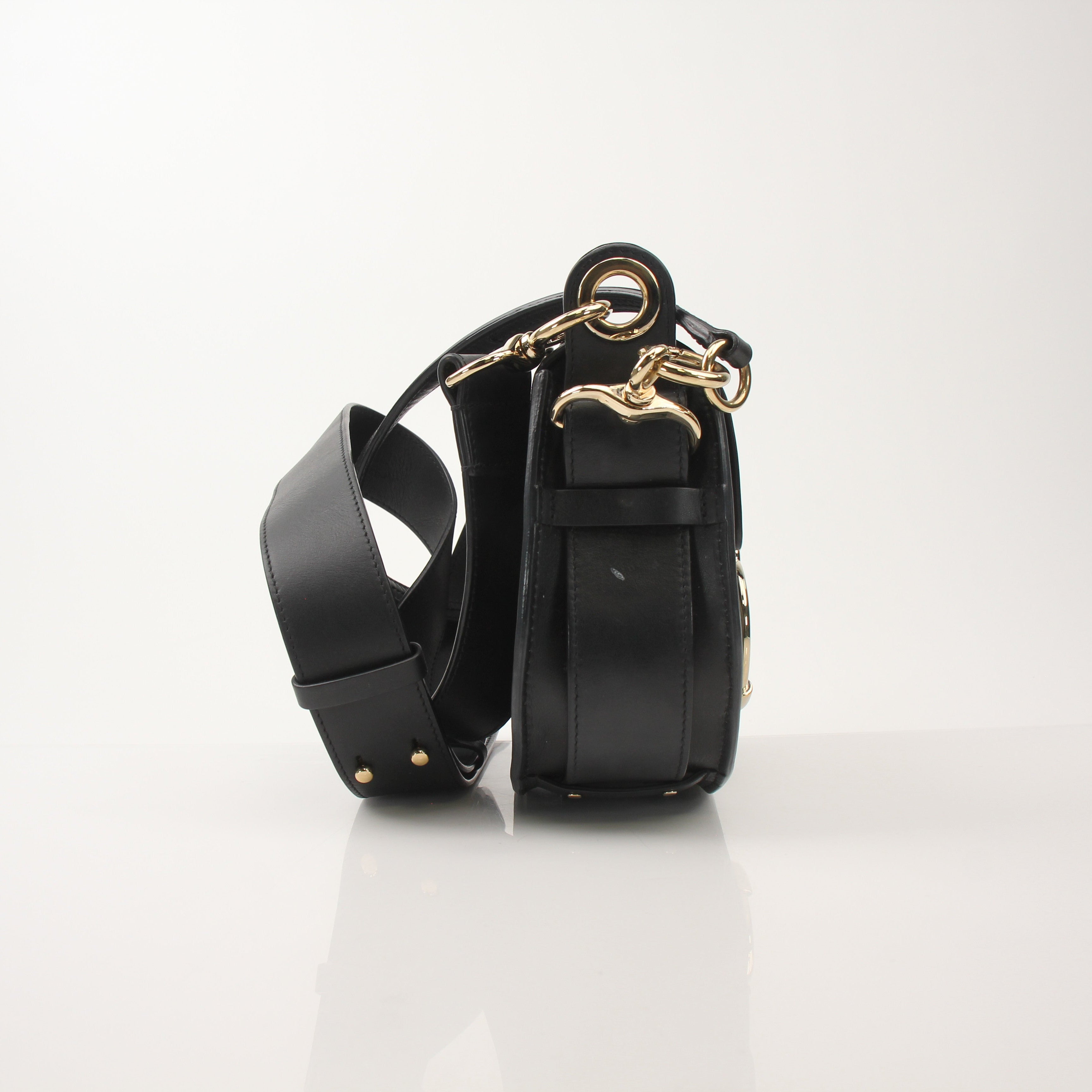 Gold & Beyond Chloé Tess Saddle Bag handbag with leather strap and signature saddle design, detailed close-up shot.
