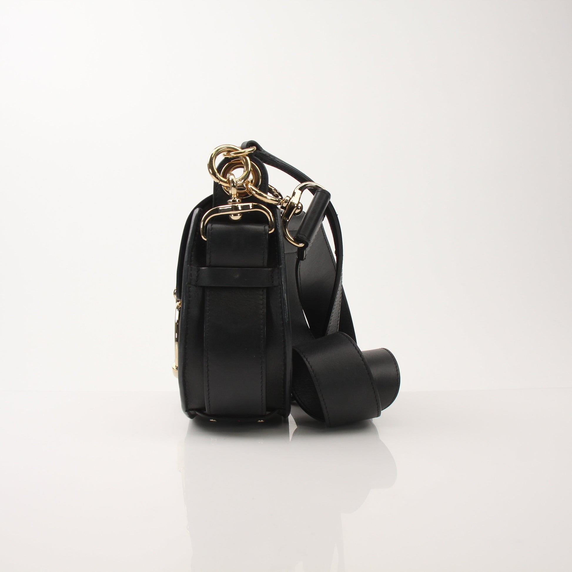 Gold & Beyond Chloé Tess Saddle Bag handbag with adjustable strap and signature saddle shape, shown in a close-up view.