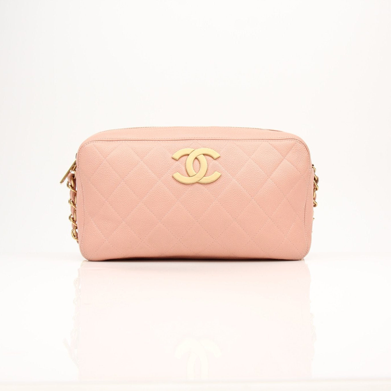 Gold & Beyond Chanel pink caviar leather classic CC handbag with gold hardware and quilted design.
