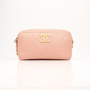 Gold & Beyond Chanel pink caviar leather classic CC handbag with gold hardware and quilted design.