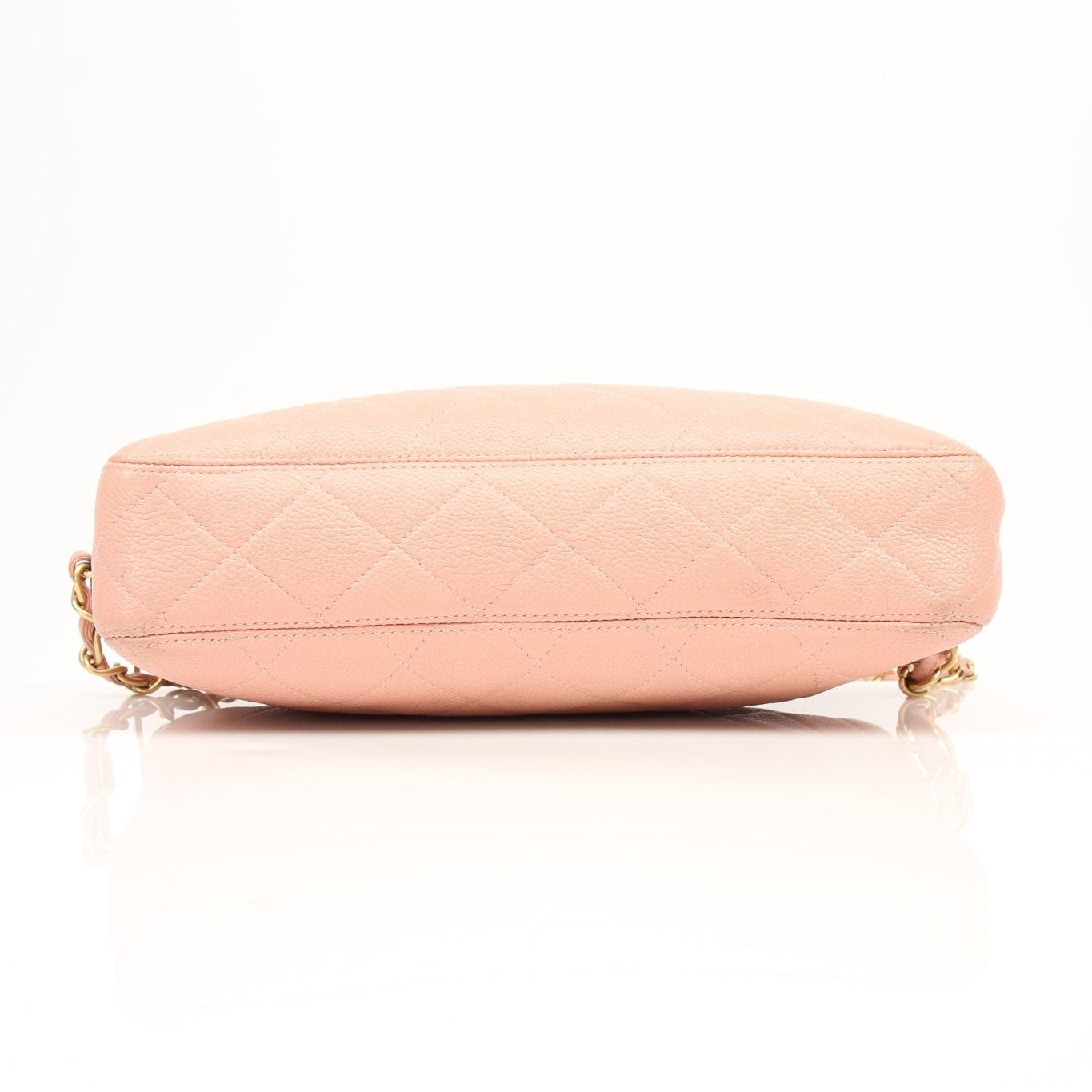 Pink Chanel Caviar Classic CC handbag with gold chain strap and signature design, displayed on a neutral background.