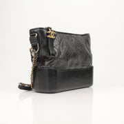 Gold & Beyond Chanel Gabrielle black hobo handbag with quilted leather and gold-tone hardware, stylish and spacious for everyday use.