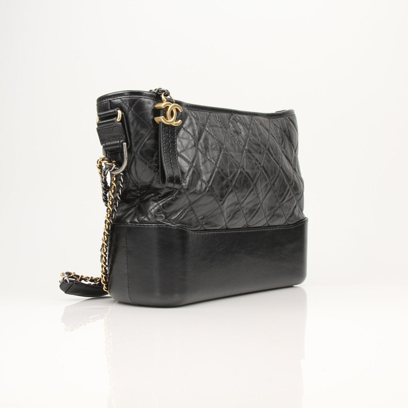 Gold & Beyond Chanel Gabrielle black hobo handbag with quilted leather and gold-tone hardware, stylish and spacious for everyday use.