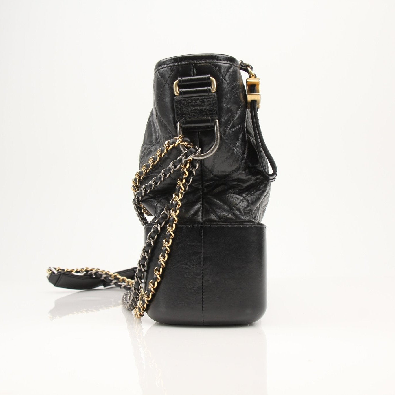 Chanel Gabrielle black hobo handbag with gold accents, soft leather body, and adjustable shoulder strap, stylish and luxurious.