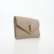 Saint Laurent Cassandre matelassé beige envelope clutch handbag with gold accents and sleek design, featuring a flap closure and compact size.