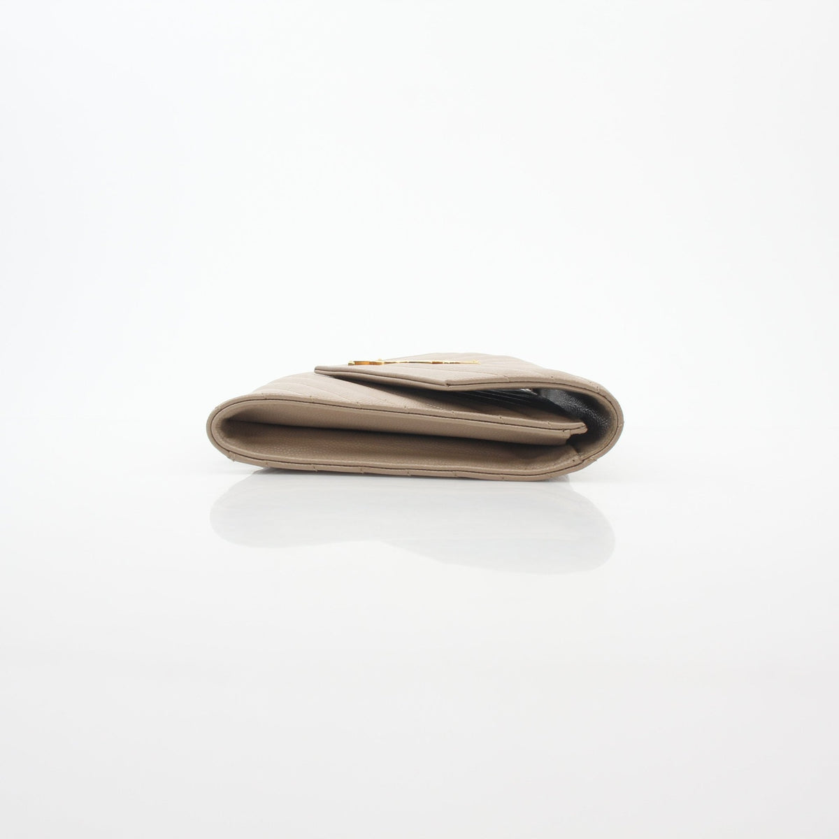 Dark beige Saint Laurent Cassandre Matelassé envelope clutch handbag with gold-tone hardware and quilted pattern.