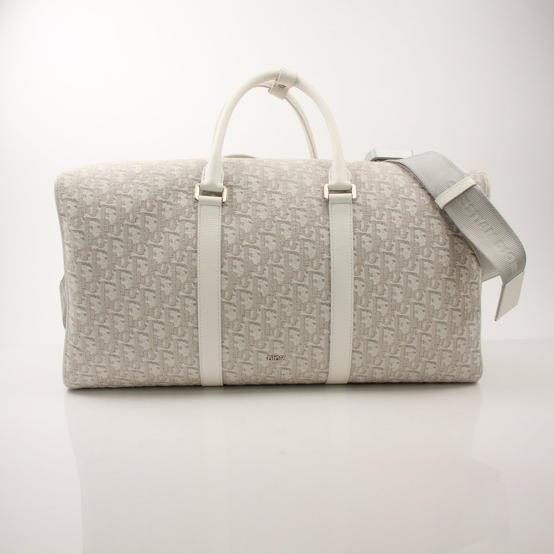 Christian Dior 2022 Lingot 50 duffle bag for travel, featuring sleek design and durable materials, by Gold & Beyond.