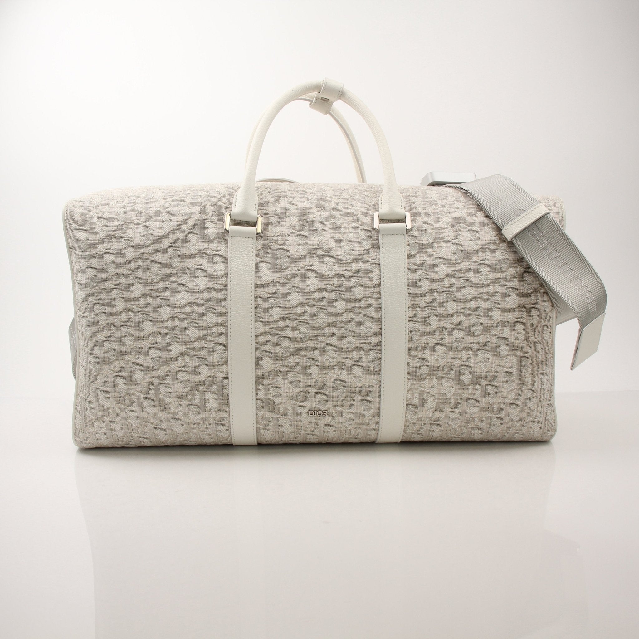 Christian Dior 2022 Lingot 50 duffle bag for travel, featuring sleek design and durable materials, by Gold & Beyond.