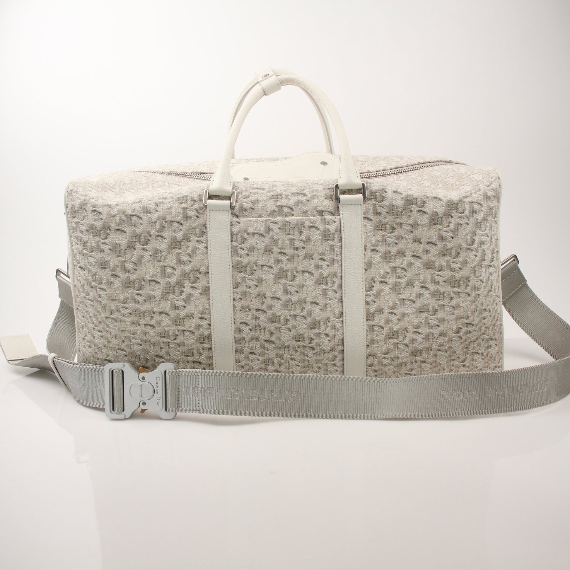 Christian Dior Lingot 50 duffle bag by Gold & Beyond, stylish travel bag with leather handles and Dior branding.