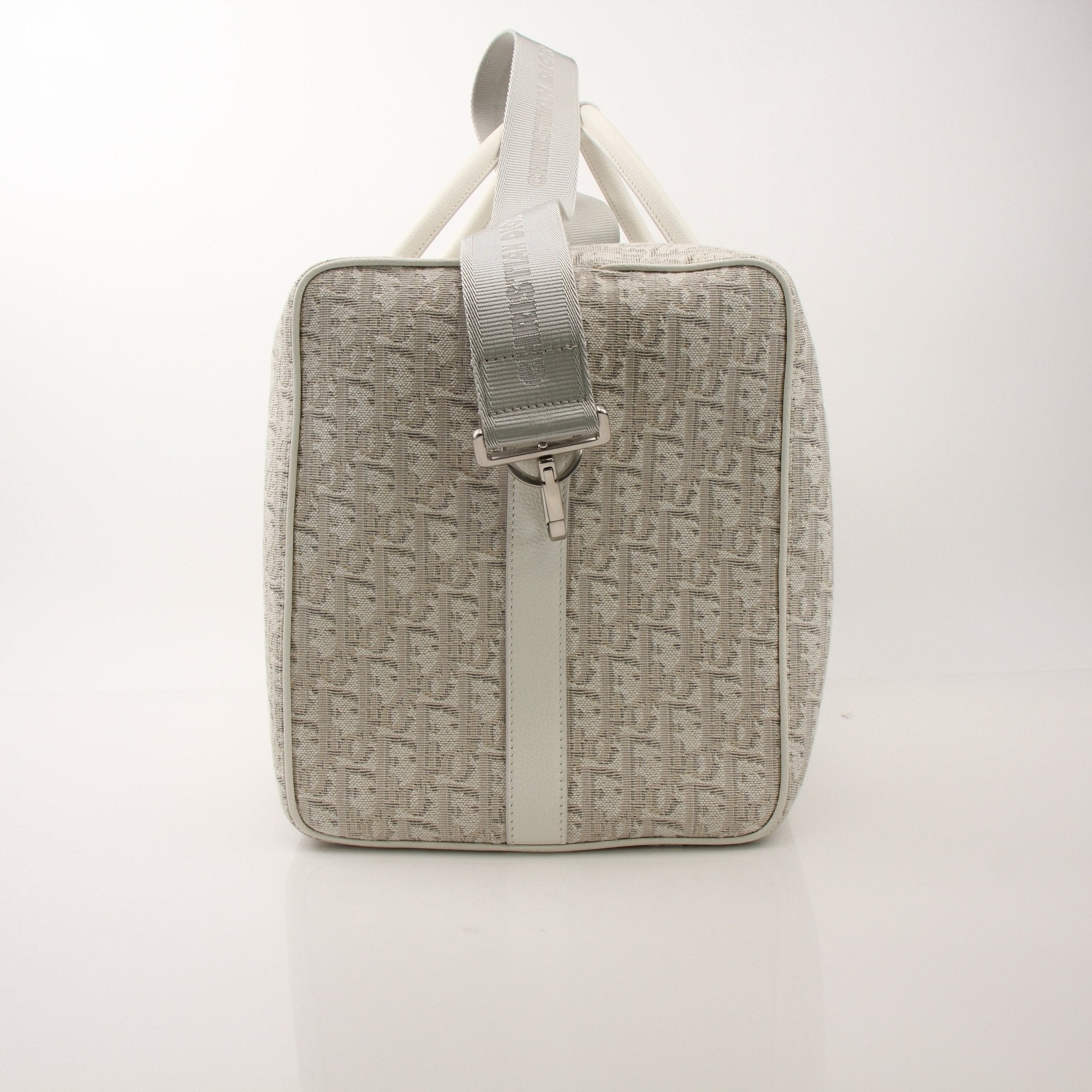 Christian Dior Lingot 50 duffle bag in black with gold-tone hardware, designed for travel and luxury styling.