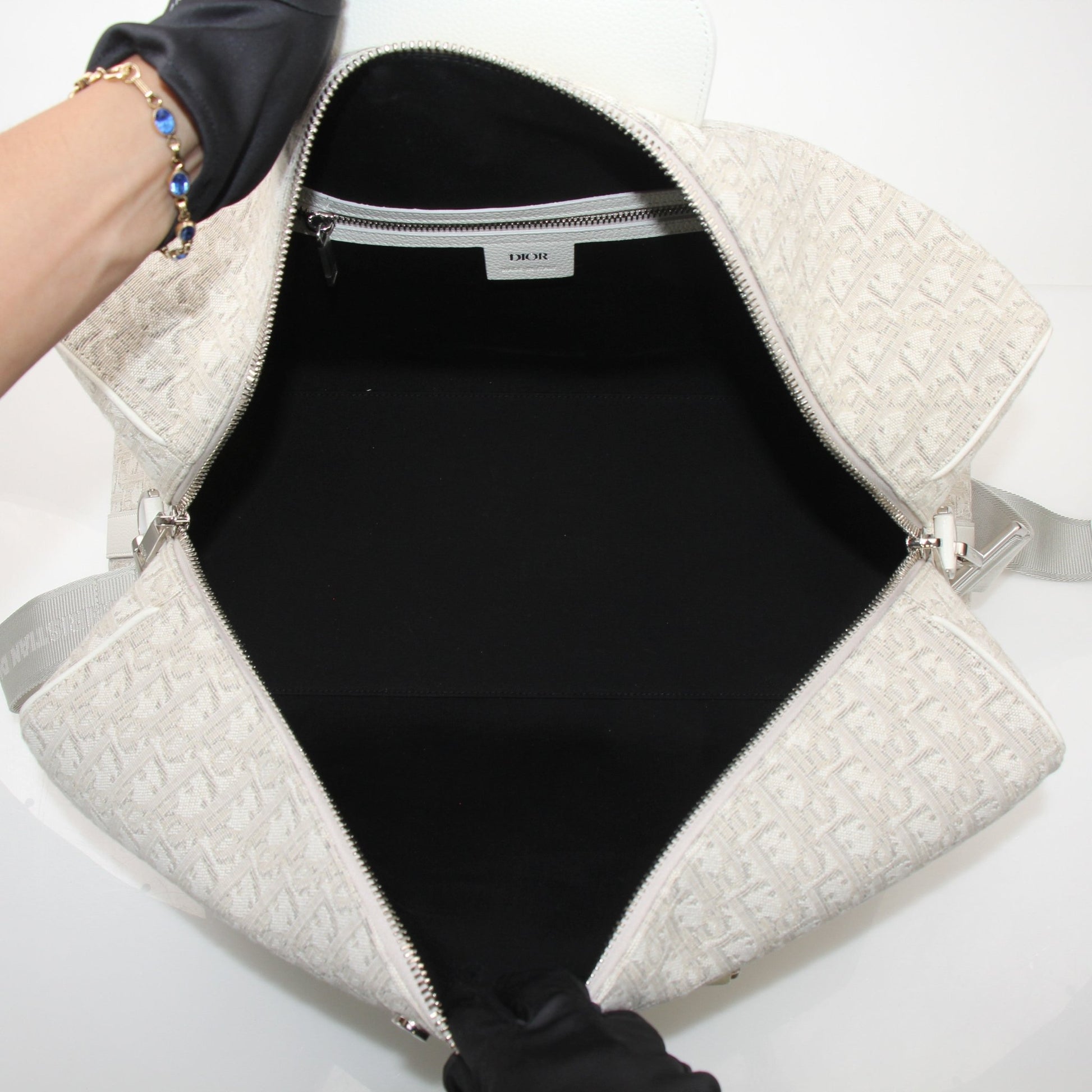 Christian Dior 2022 Lingot 50 duffle bag by Gold & Beyond, stylish travel bag with leather accents and spacious interior.