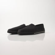 Prada men's triangle logo nylon slip-on loafers with sleek design and comfortable fit in black with logo detail.