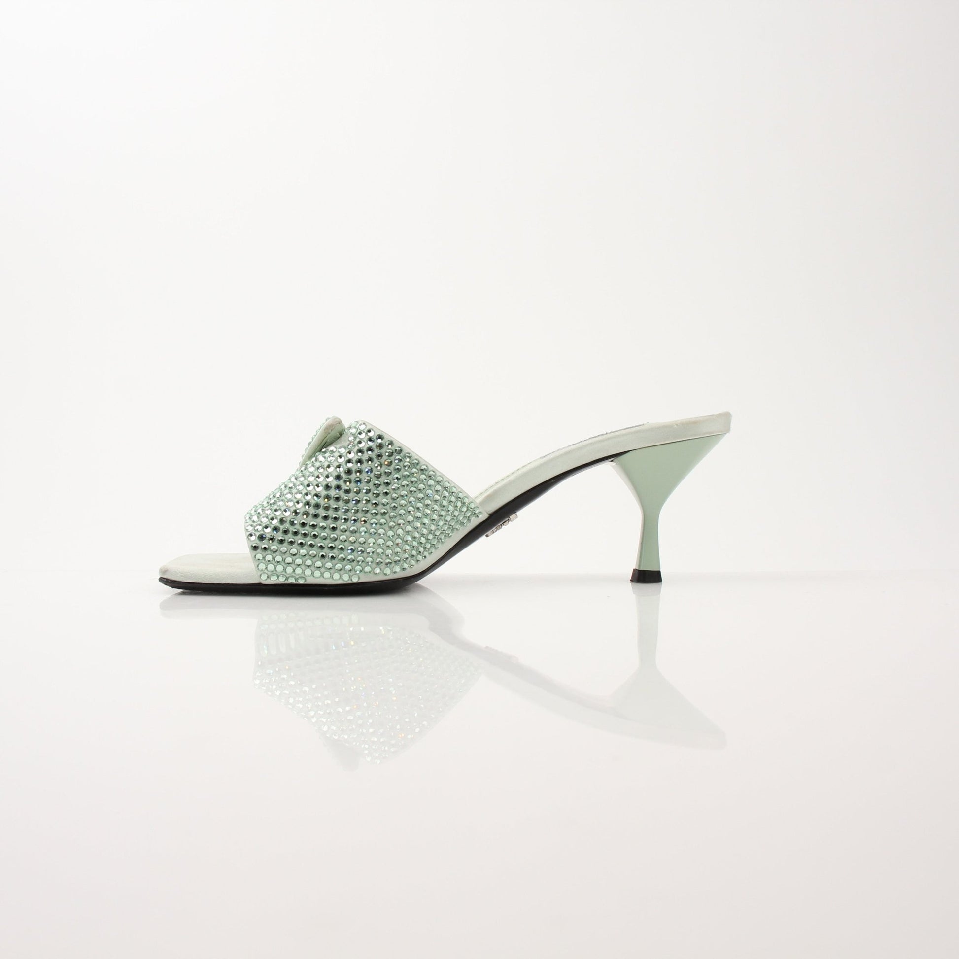 Gold & Beyond Prada women's crystal-embellished open-toe mules heels, stylish and elegant footwear with sparkling details.