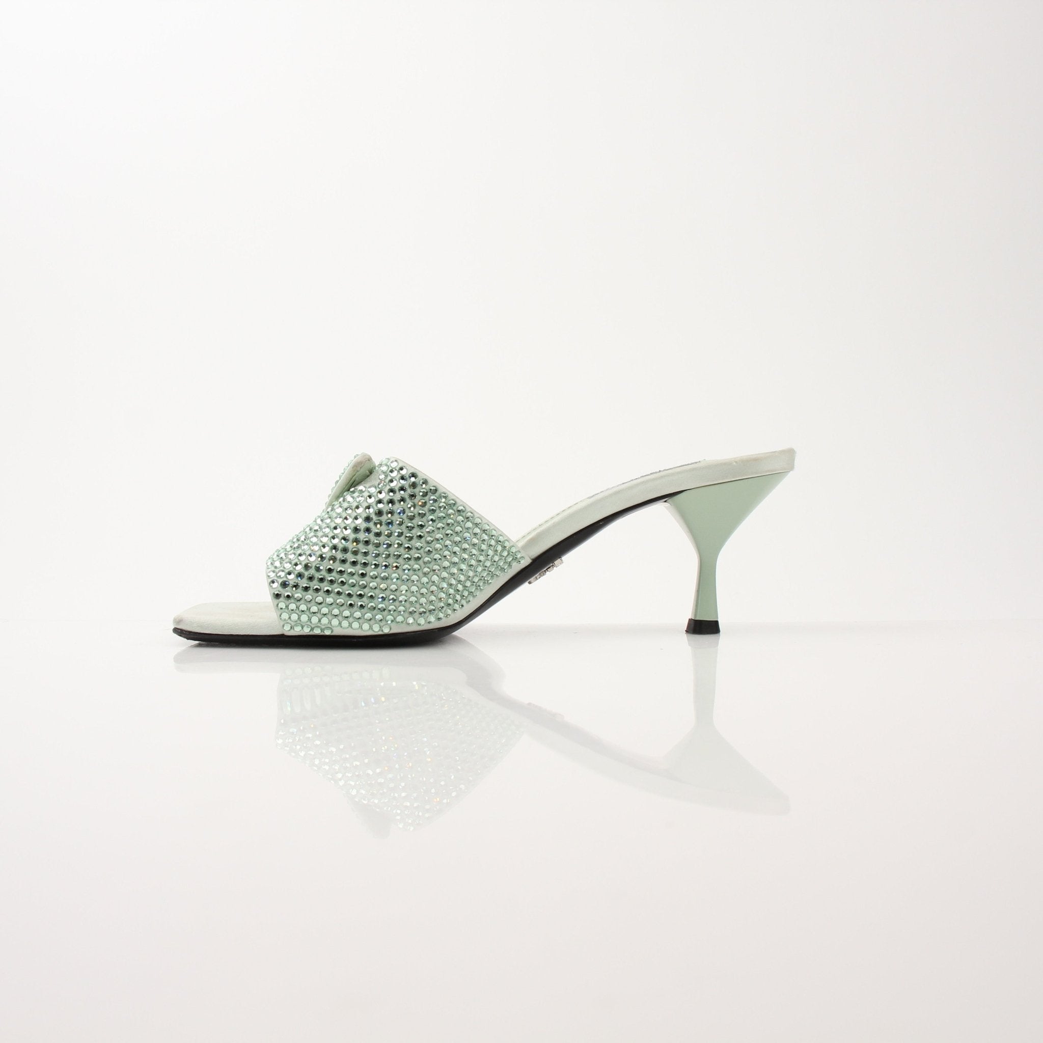 Gold & Beyond Prada women's crystal-embellished open-toe mules heels, stylish and elegant footwear with sparkling details.