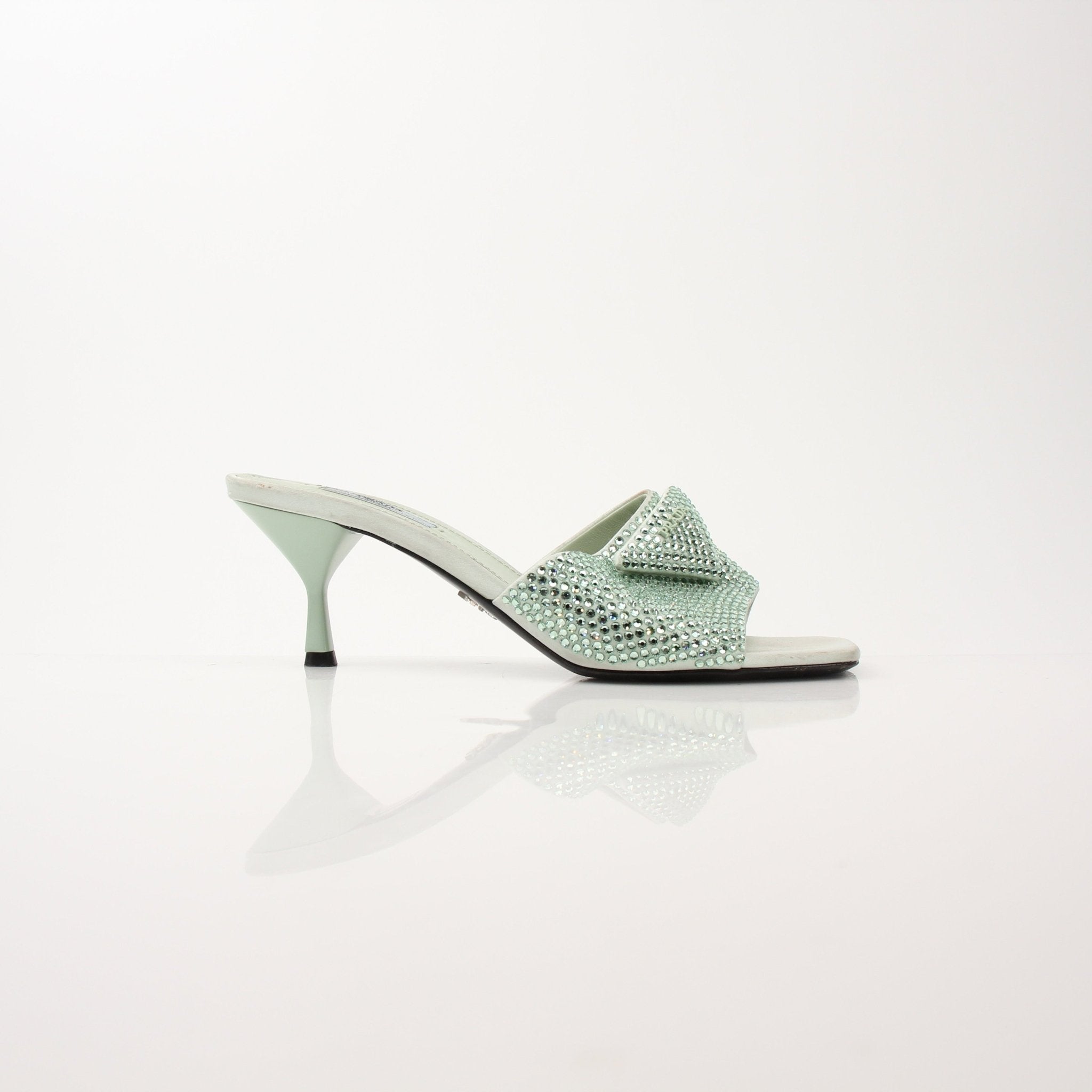 Gold & Beyond Prada women's crystal-embellished open-toe mule heels with elegant heel and stylish design.