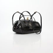 Black Chanel Pretty CC croc-embossed barrel handbag with gold hardware, featuring top handles and a structured shape.