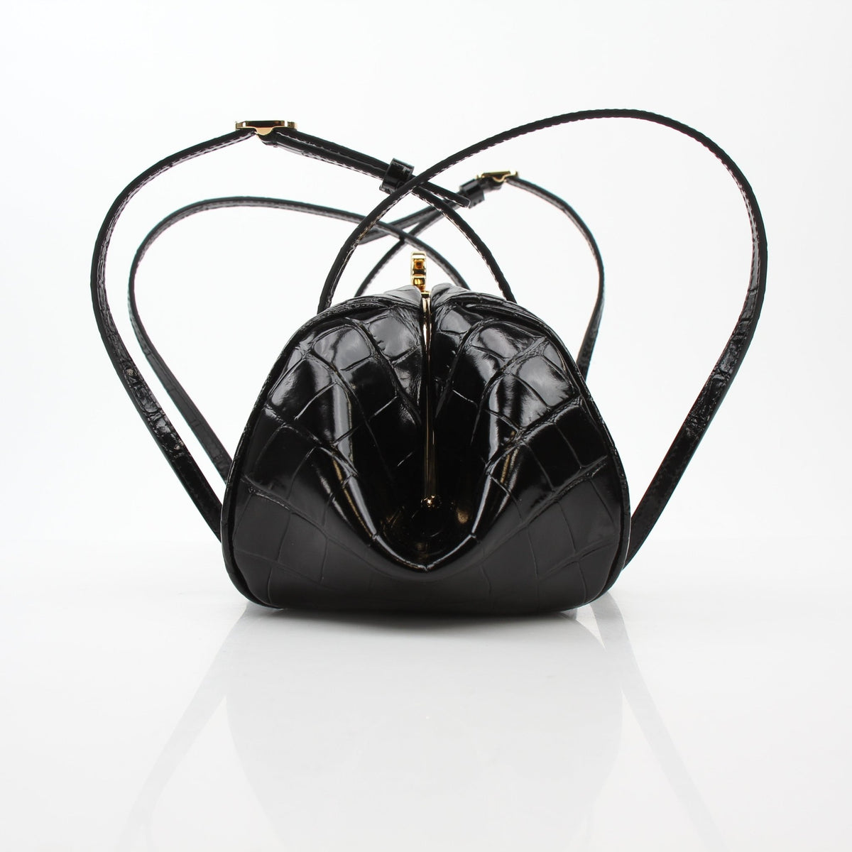 Black Chanel Pretty CC croc-embossed barrel handbag with gold accents, stylish and luxurious for everyday or special occasions.
