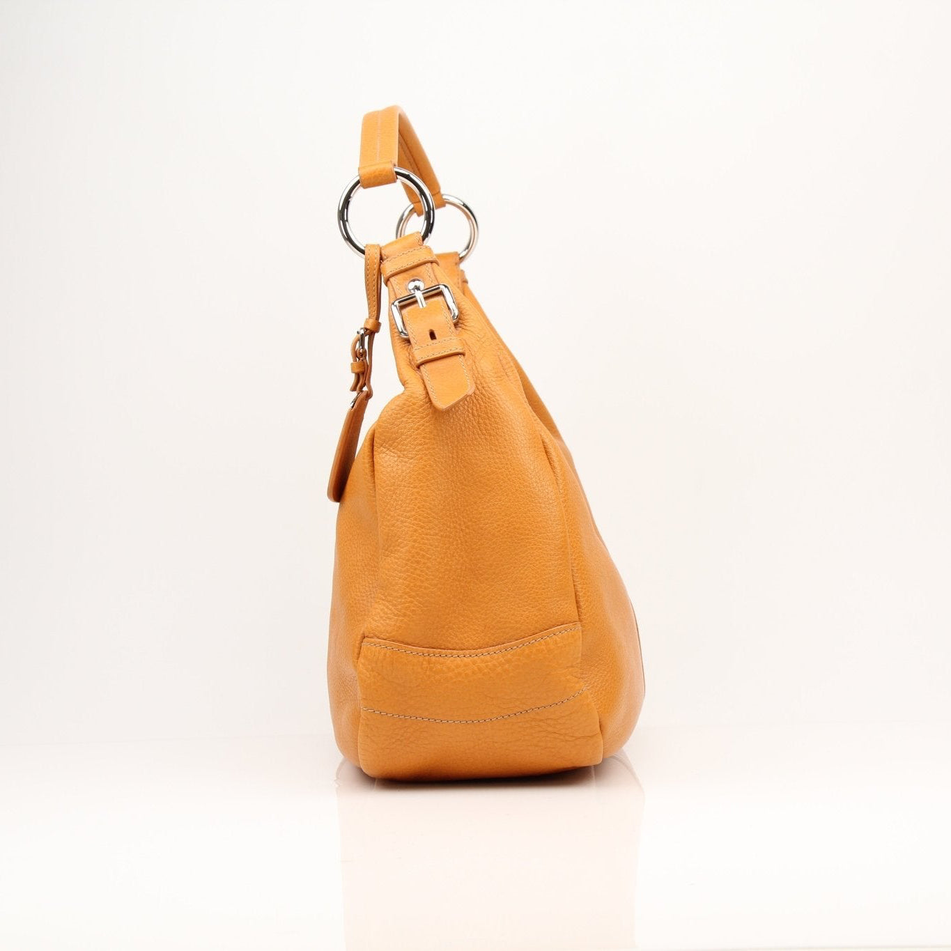 Prada orange Daino leather handbag with elegant design and gold-tone hardware, stylish accessory for any occasion.