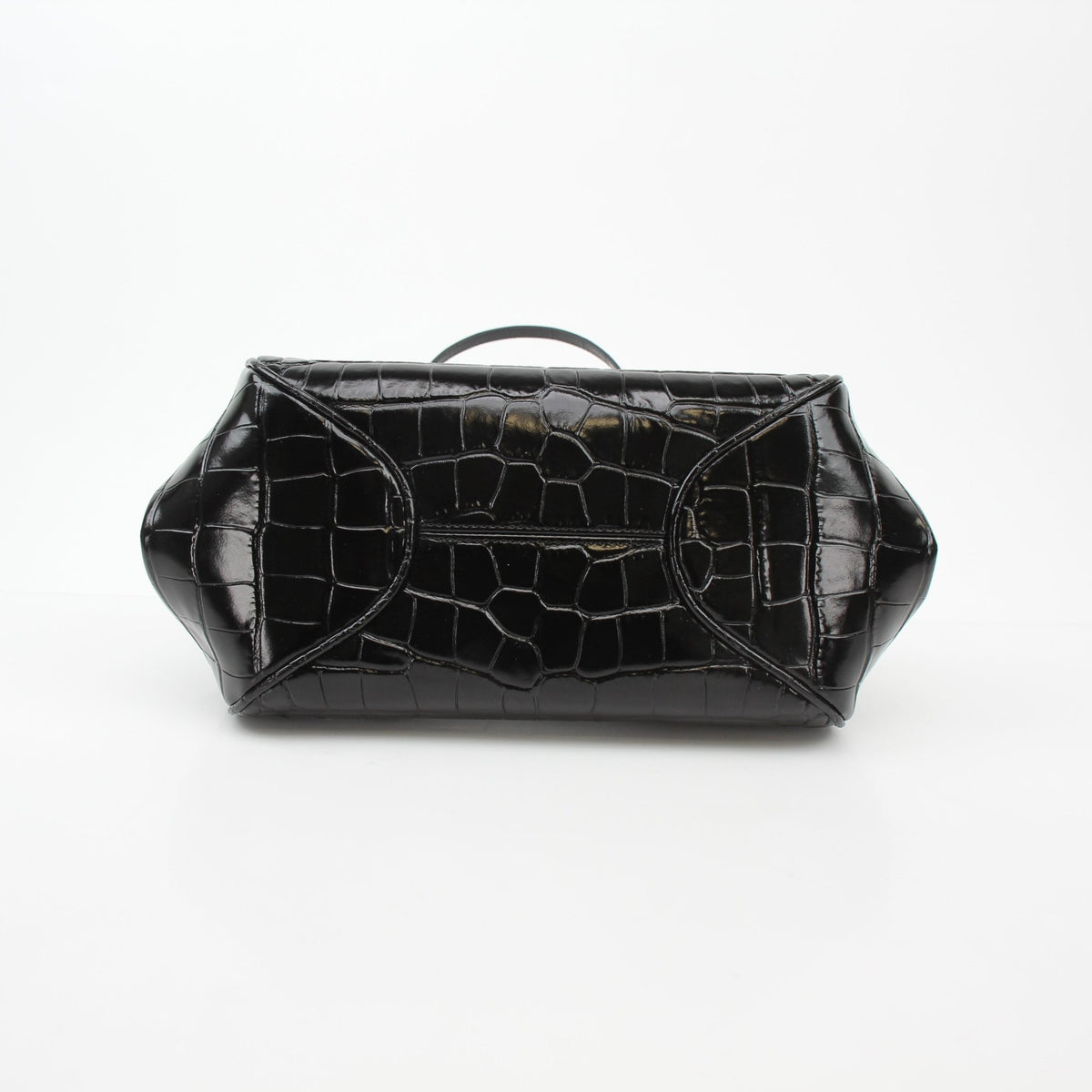 Black Chanel Pretty CC croc-embossed barrel handbag with gold accents, featuring the signature CC logo and structured design.