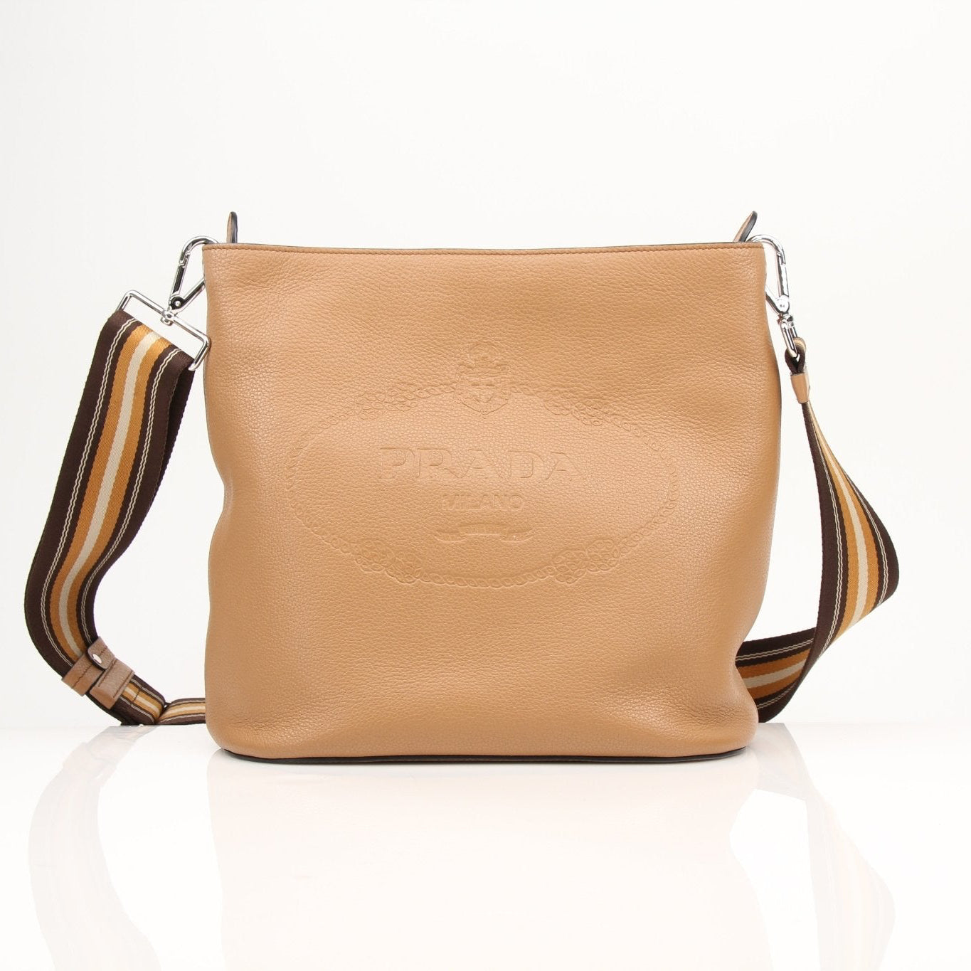 Prada Phenix bucket handbag with leather exterior and metal hardware, featuring a drawstring closure and adjustable strap.