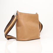 Prada Phenix bucket handbag with leather and fabric design, featuring a drawstring closure and stylish shoulder strap.