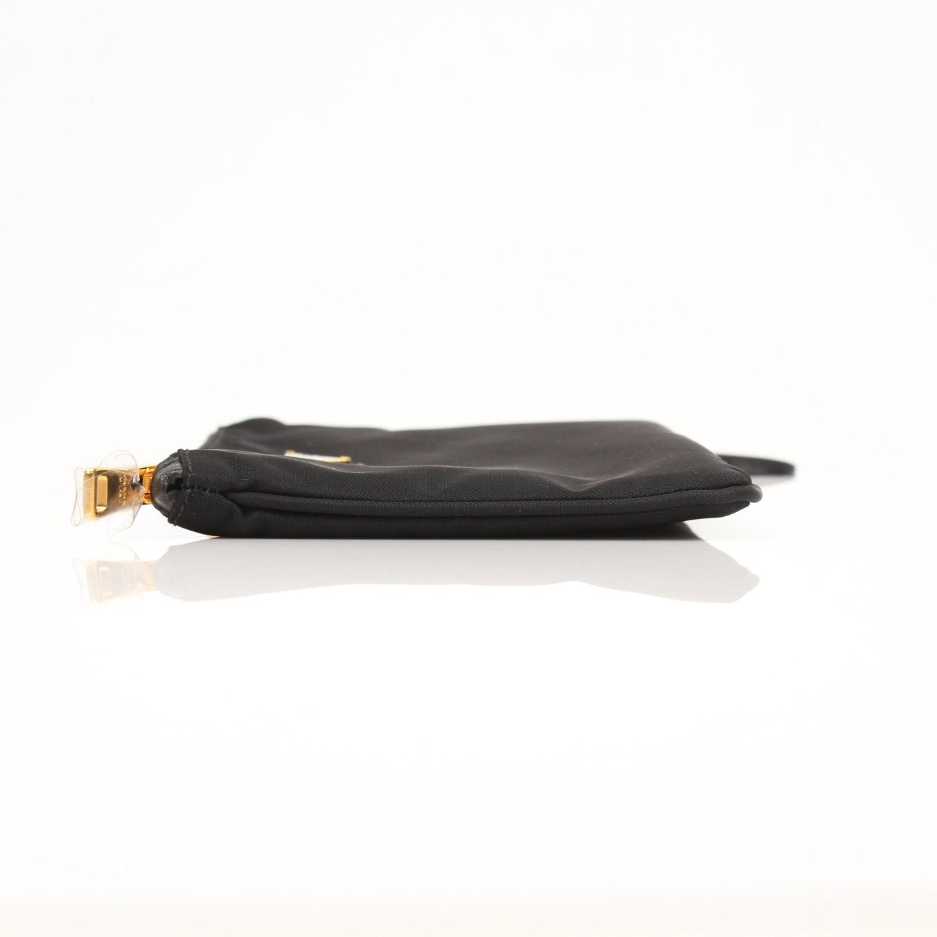Prada black Re-Nylon wristlet with zipper closure, featuring a sleek, minimalist design and subtle branding.