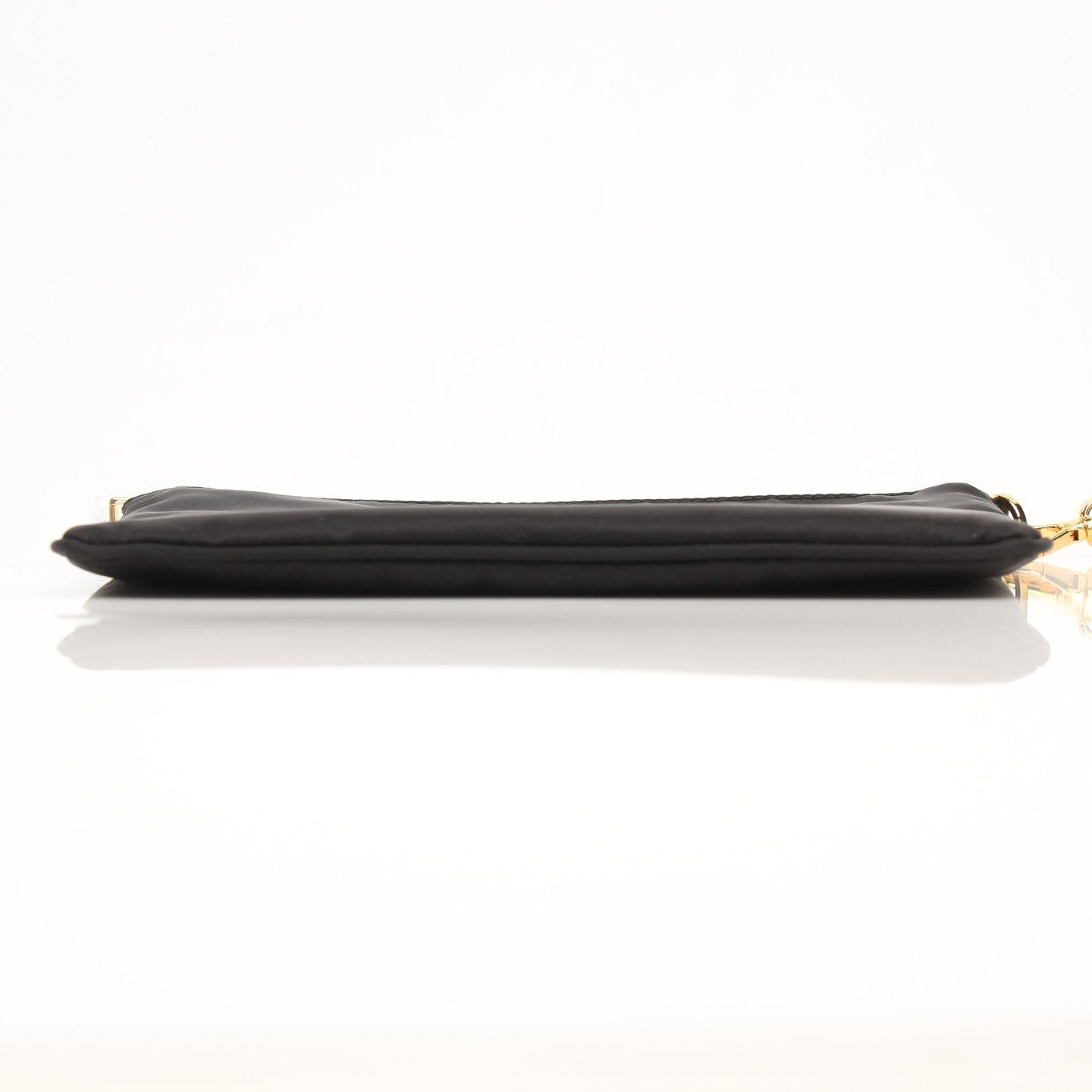 Prada black Re-Nylon wristlet with sleek design and zip closure, featuring the Prada logo on the front.