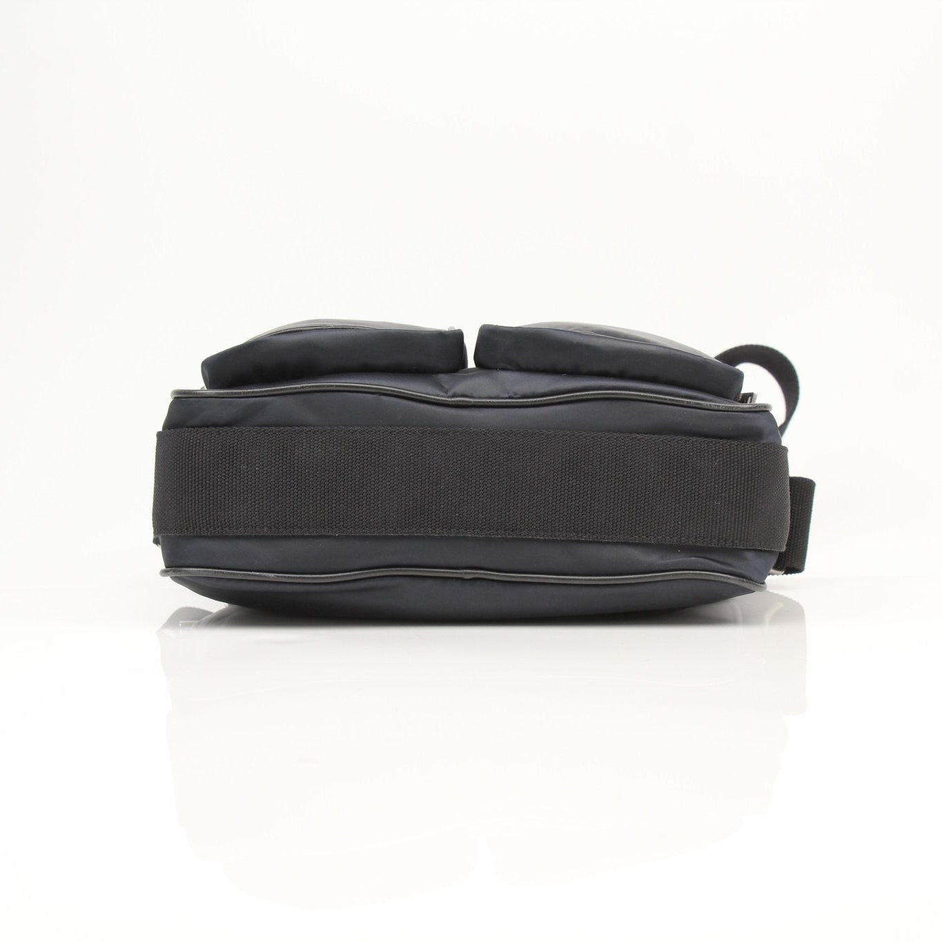 Black leather shoulder bag from YSL, designed for travel, by Gold & Beyond, featuring sleek, stylish leather with gold accents.