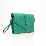 YSL green quilted leather handbag with gold accents, stylish designer pouch with textured stitching and compact design.