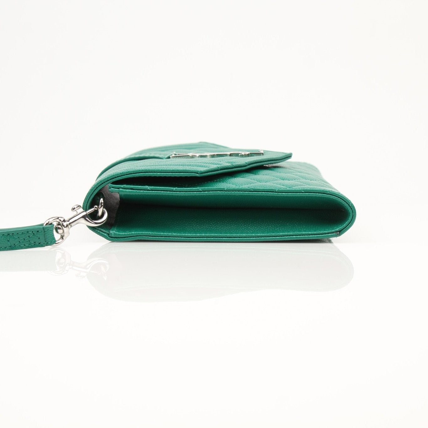 YSL green quilted leather handbag with gold hardware, compact and stylish pouch for essentials.