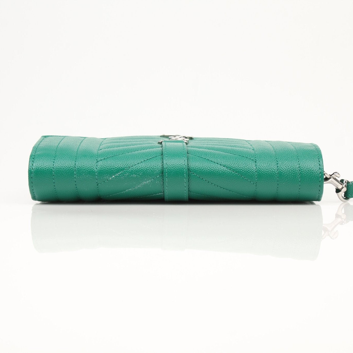 Gold & Beyond YSL green quilted leather handbag with gold hardware and a sleek, compact design.