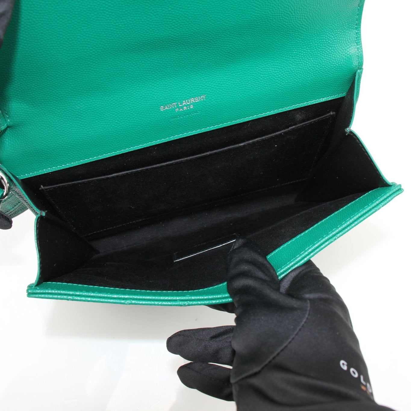 Gold & Beyond YSL green quilted leather handbag with gold accents and zip closure, showcasing a stylish and compact design.