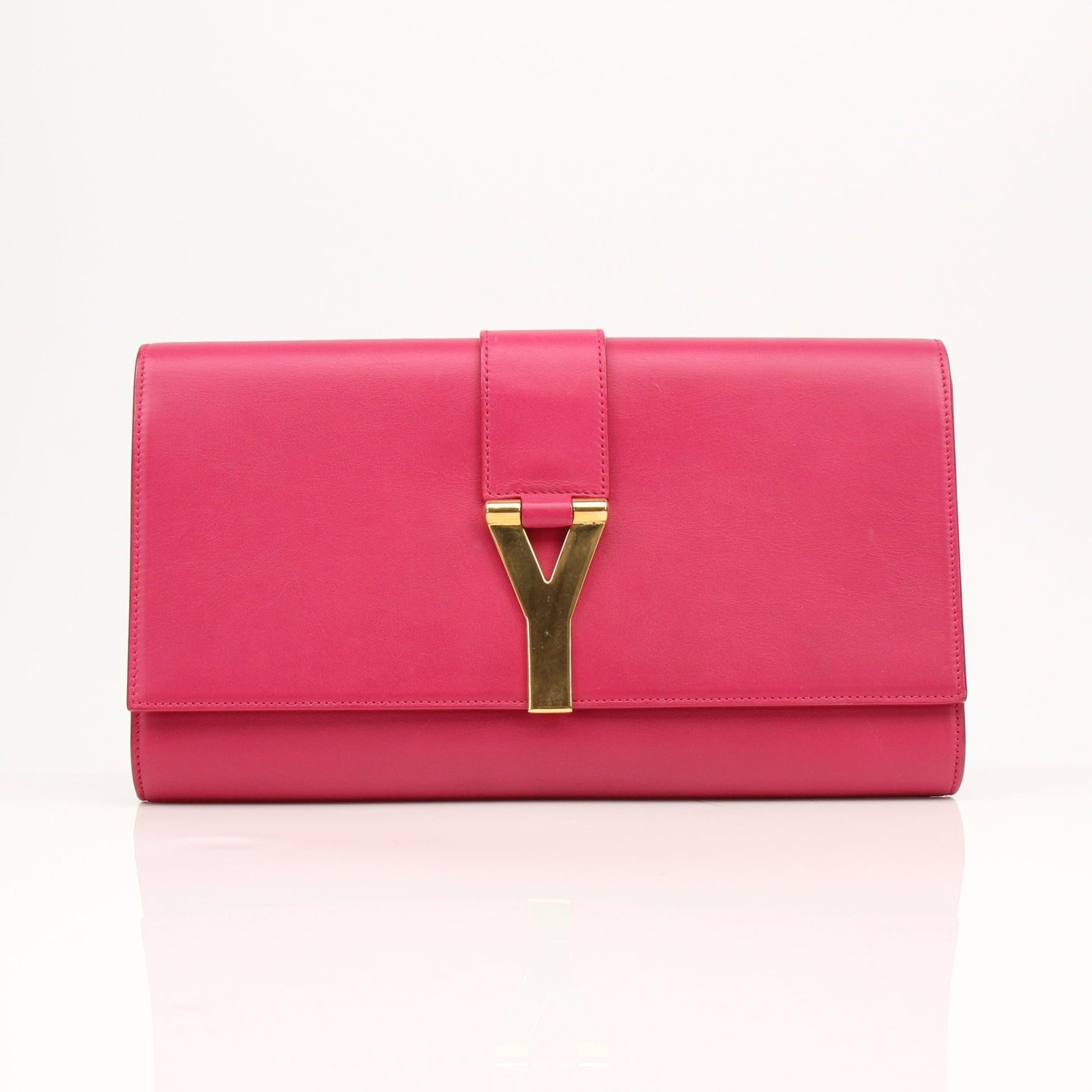 Gold & Beyond Yves Saint Laurent Chyc leather clutch handbag with sleek design and gold-tone accents.