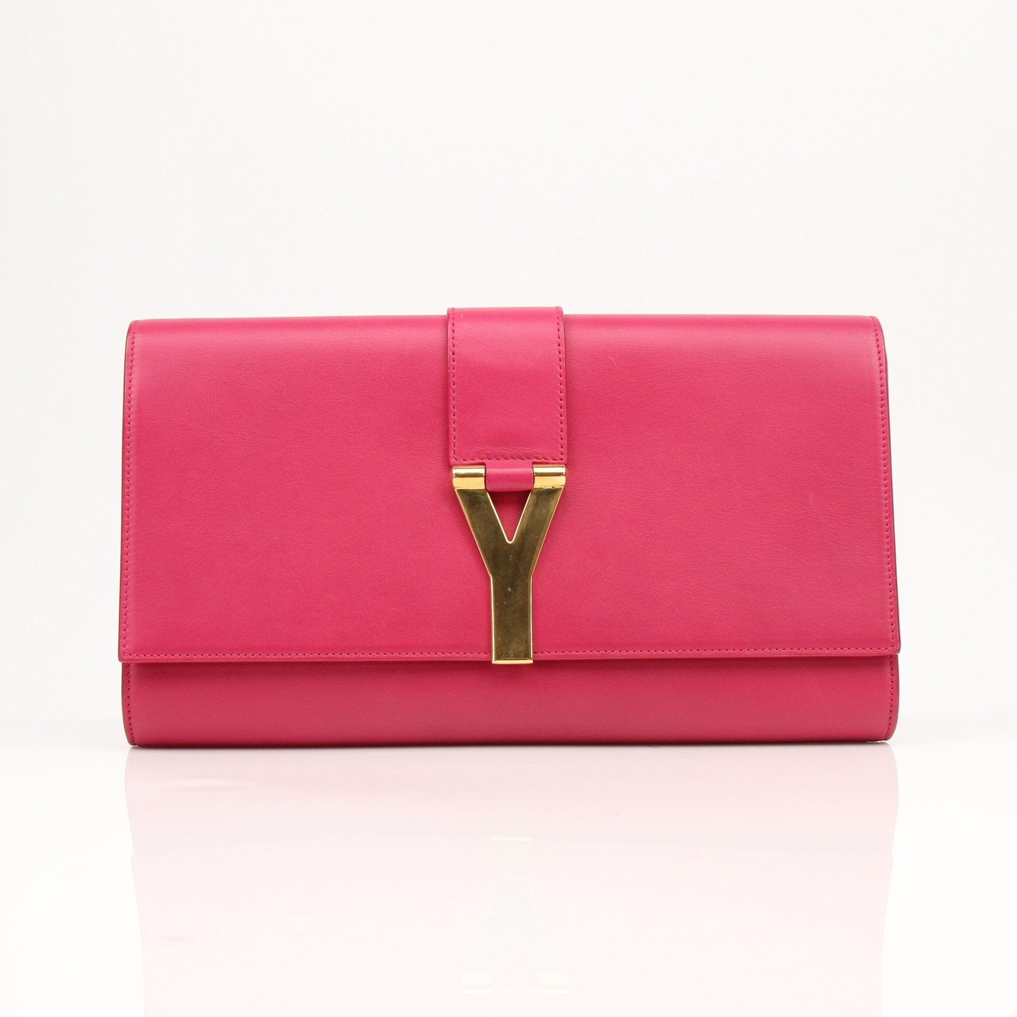 Gold & Beyond Yves Saint Laurent Chyc leather clutch handbag with sleek design and gold-tone accents.