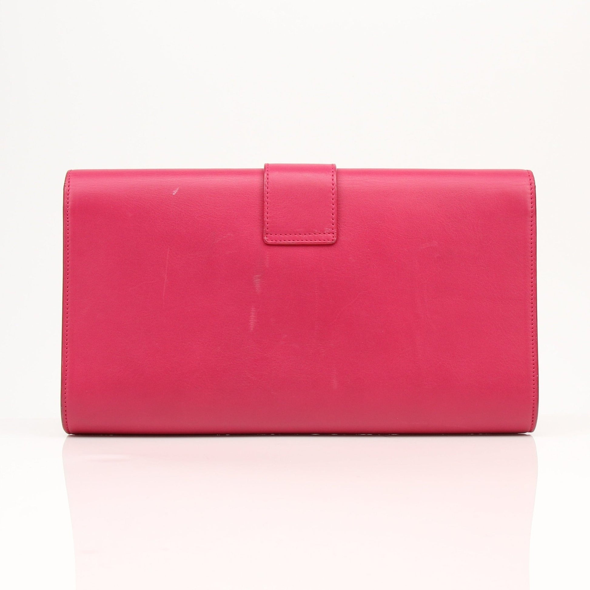 Gold & Beyond Yves Saint Laurent Chyc leather clutch handbag with sleek design and gold-tone accents.