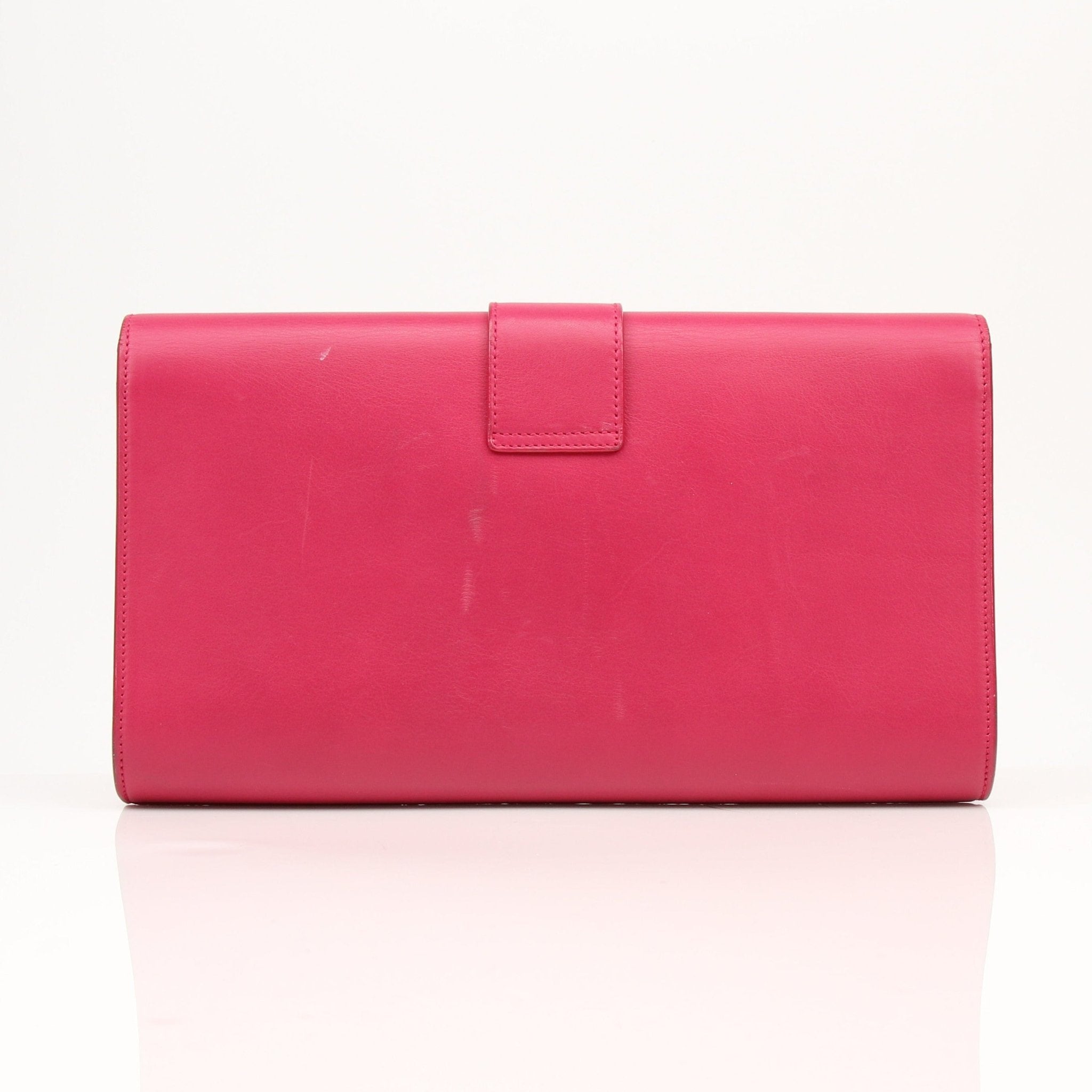 Gold & Beyond Yves Saint Laurent Chyc leather clutch handbag with sleek design and gold-tone accents.