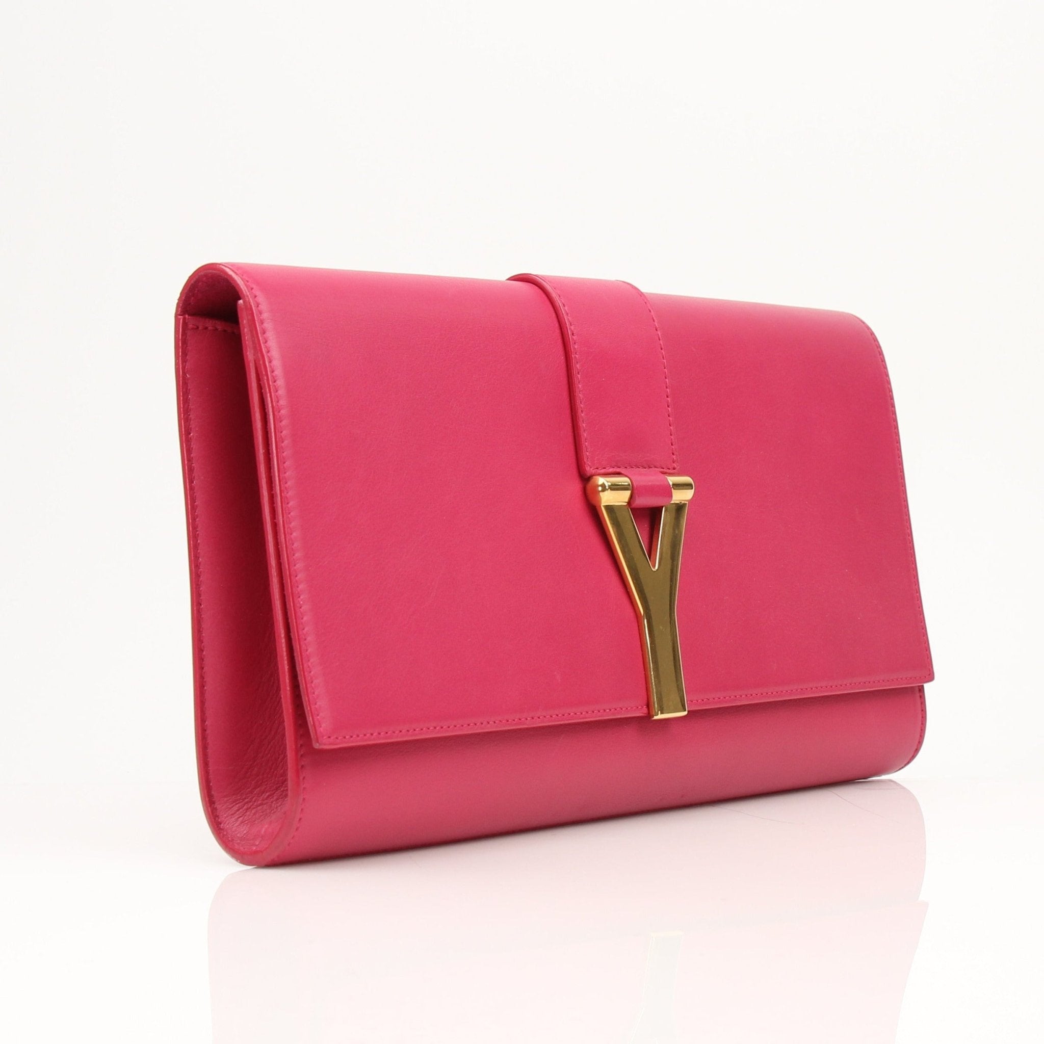 Gold & Beyond Yves Saint Laurent Chyc leather clutch handbag with sleek design and gold-tone hardware.