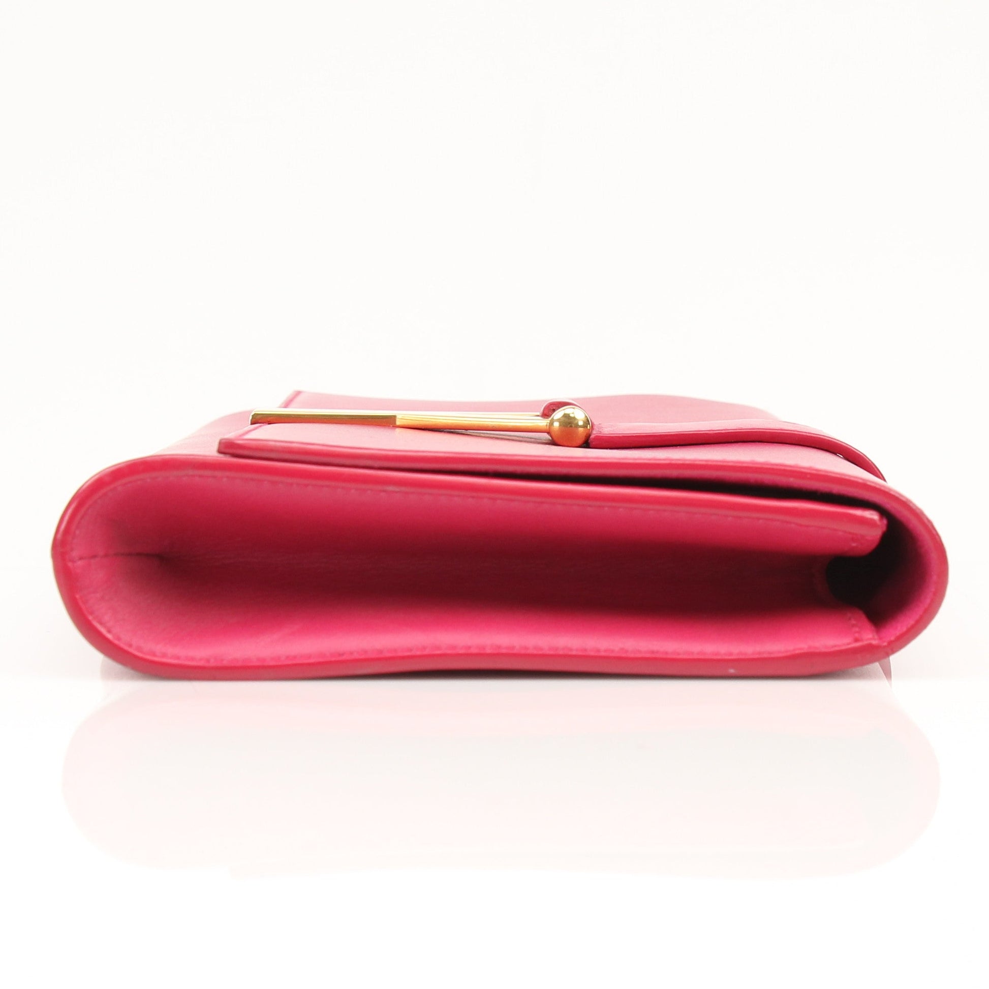 Gold & Beyond Yves Saint Laurent Chyc leather clutch handbag with sleek design and gold-tone accents.